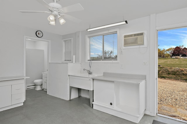 11610 W Lanktree Gulch Rd, Star, ID 83669 - interior space with ceiling fan, an AC wall unit, and a baseboard radiator
