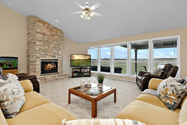 11610 W Lanktree Gulch Rd, Star, ID 83669 - living room with carpet flooring, ceiling fan, vaulted ceiling, and a stone fireplace