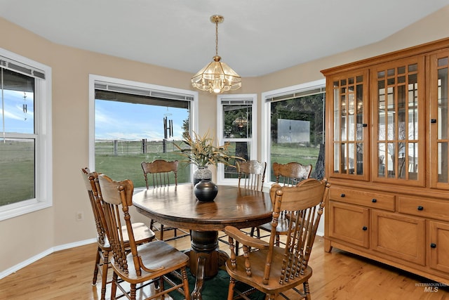 11610 W Lanktree Gulch Rd, Star, ID 83669 - dining room with light wood-style flooring, a notable chandelier, and baseboards
