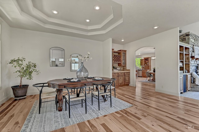 352 N Panorama Pl, Boise, ID 83702 - dining room with arched walkways, light wood finished floors, recessed lighting, and a raised ceiling