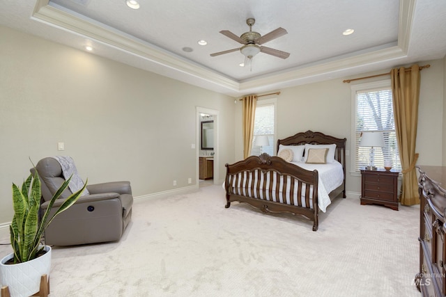 bedroom featuring light carpet, recessed lighting, a raised ceiling, and baseboards