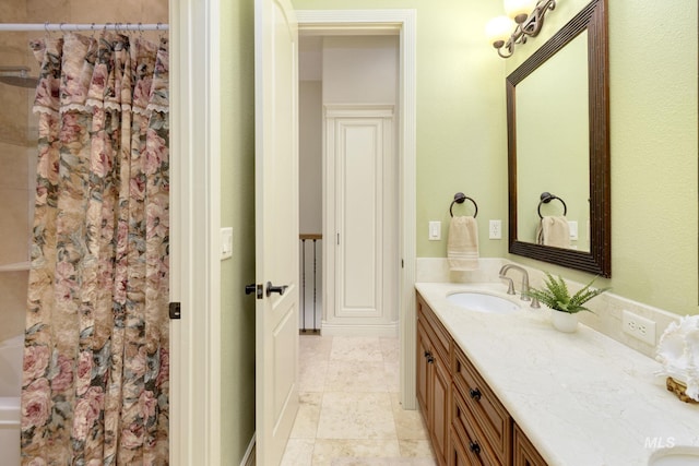 full bathroom with tile patterned flooring, shower / tub combo with curtain, and vanity