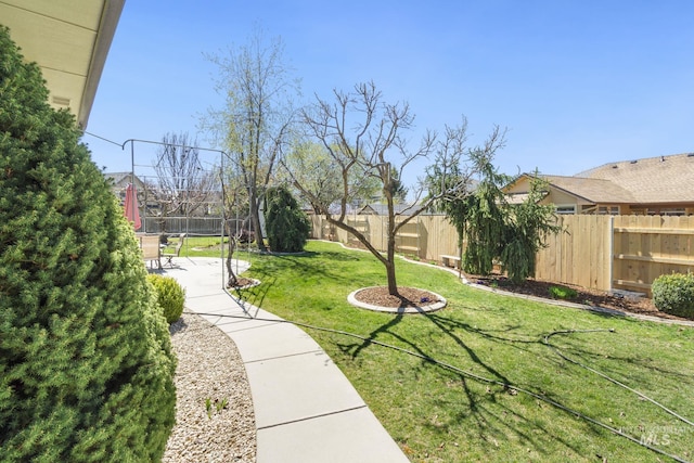 view of yard with a patio and a fenced backyard