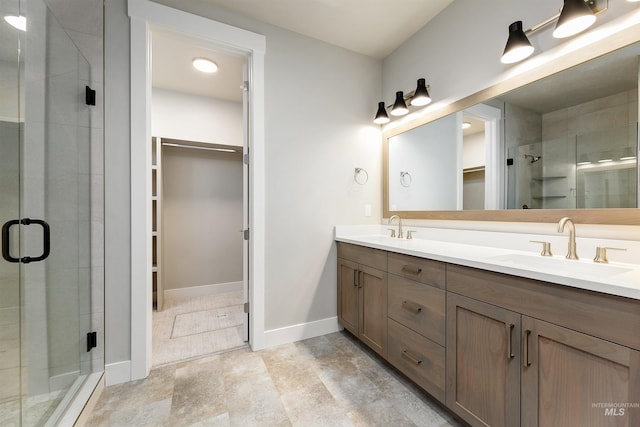 2330 E Monhegan Dr, Eagle, ID 83616 - full bath featuring a stall shower, a walk in closet, double vanity, and baseboards