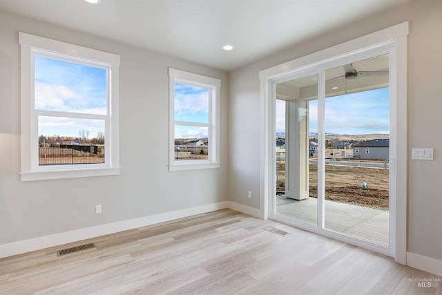 2330 E Monhegan Dr, Eagle, ID 83616 - unfurnished room featuring light wood-style flooring, recessed lighting, and baseboards