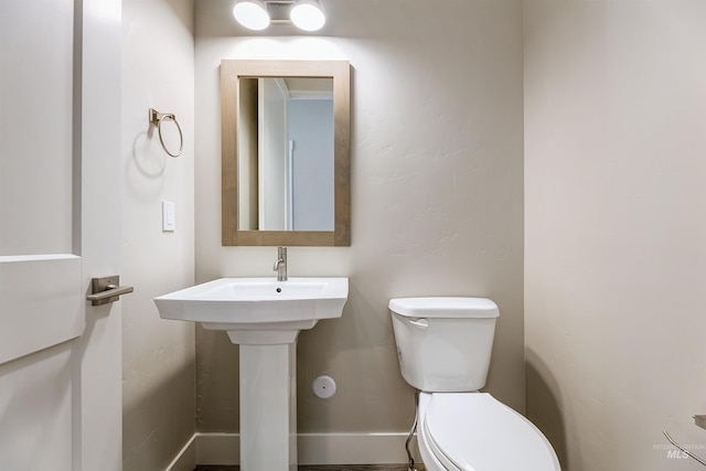 2330 E Monhegan Dr, Eagle, ID 83616 - half bath with toilet, baseboards, and a sink