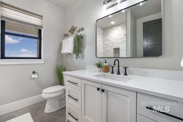 bathroom with vanity, toilet, and tile patterned flooring