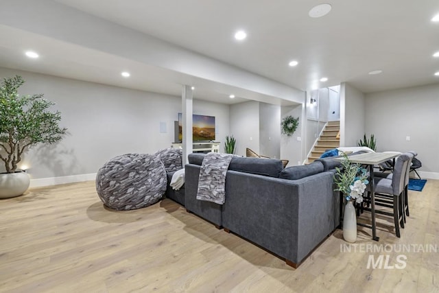 living room with light hardwood / wood-style flooring