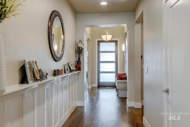 interior space featuring dark wood finished floors and baseboards