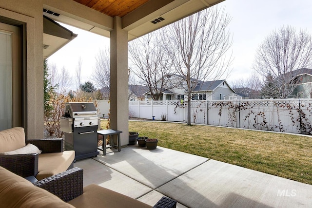 view of patio featuring a fenced backyard, visible vents, and area for grilling