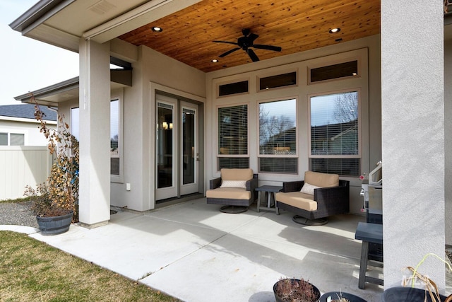 view of patio / terrace featuring ceiling fan and fence