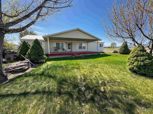 664 Lawrence Ln, Weiser, ID 83672 - rear view of property with a porch and a lawn
