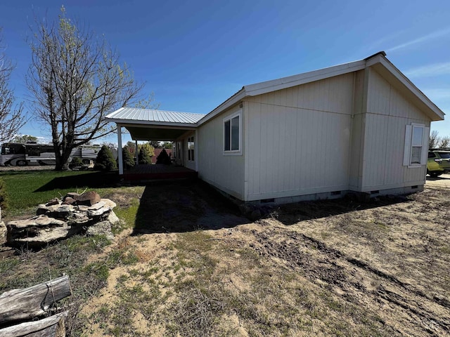 664 Lawrence Ln, Weiser, ID 83672 - view of property exterior with crawl space and metal roof