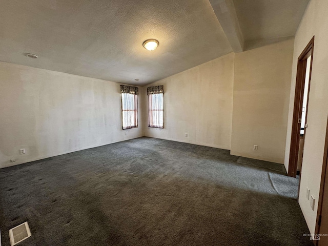 664 Lawrence Ln, Weiser, ID 83672 - unfurnished room with dark colored carpet and a textured ceiling
