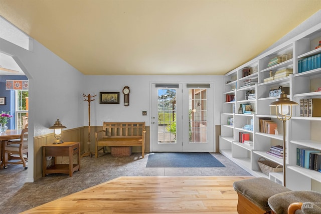 1745 Gibler Rd, Kamiah, ID 83536 - sitting room featuring plenty of natural light, arched walkways, a wainscoted wall, carpet flooring, and built in shelves