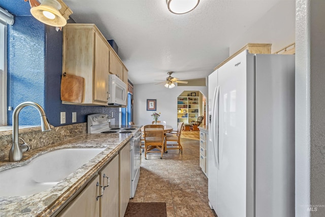 1745 Gibler Rd, Kamiah, ID 83536 - kitchen with white appliances, a sink, ceiling fan, light brown cabinets, and a textured ceiling