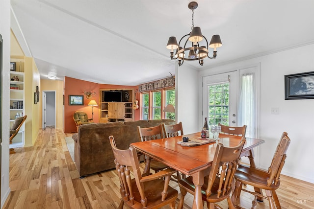 1745 Gibler Rd, Kamiah, ID 83536 - dining room featuring a chandelier, light wood-style flooring, ornamental molding, and baseboards