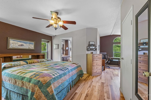 1745 Gibler Rd, Kamiah, ID 83536 - bedroom featuring light wood-style floors, multiple windows, a desk, vaulted ceiling, and a ceiling fan