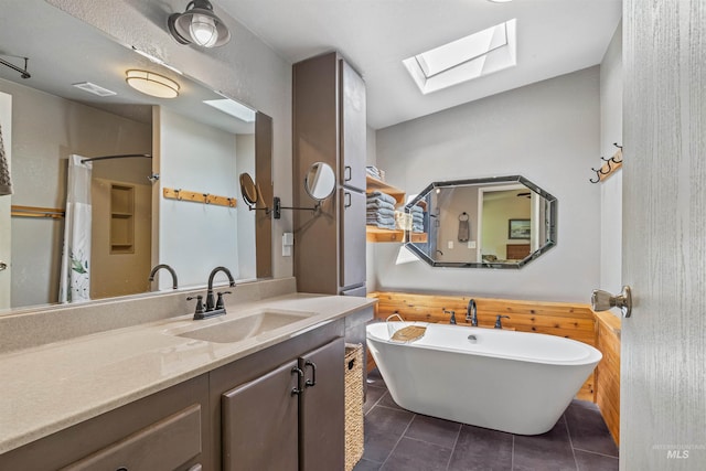 1745 Gibler Rd, Kamiah, ID 83536 - full bath featuring a skylight, tile patterned floors, a soaking tub, vanity, and curtained shower