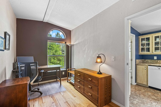 1745 Gibler Rd, Kamiah, ID 83536 - office featuring vaulted ceiling, a textured wall, a textured ceiling, light wood-style floors, and baseboards