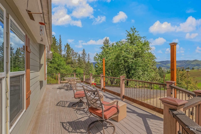 1745 Gibler Rd, Kamiah, ID 83536 - deck featuring a mountain view and outdoor dining space