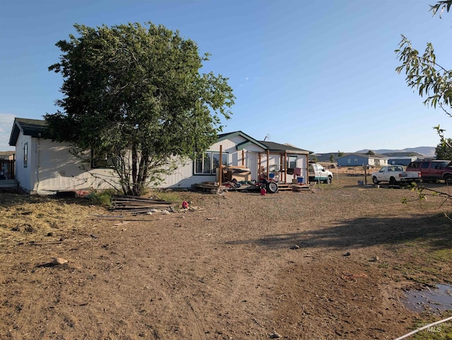 12605 Cinnabar, Murphy, ID 83650 - rear view of house featuring a sunroom