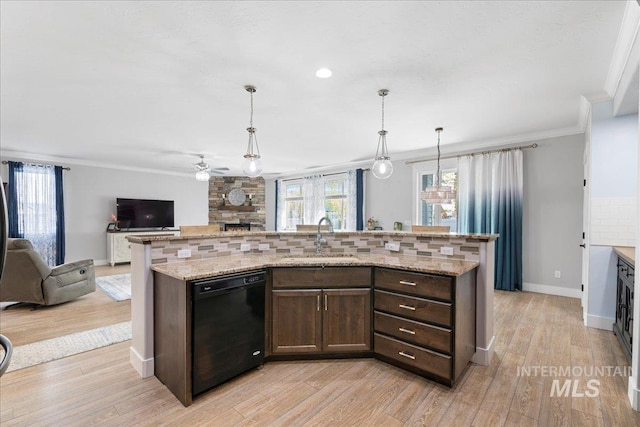 kitchen with ceiling fan, a sink, a fireplace, dishwasher, and open floor plan