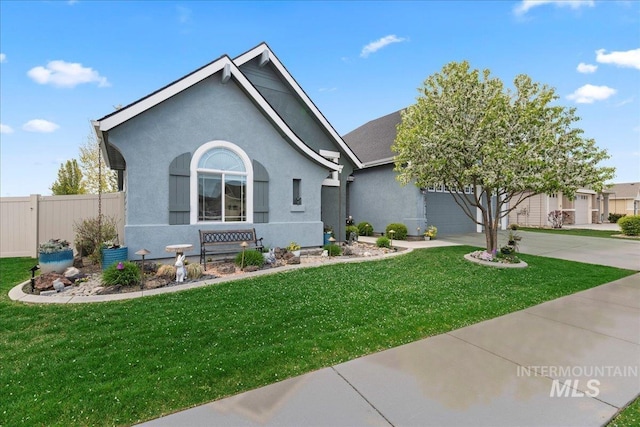 single story home featuring fence, an attached garage, a front lawn, stucco siding, and concrete driveway