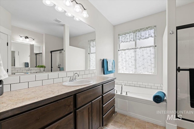 full bath with a bath, visible vents, tasteful backsplash, a shower stall, and vanity