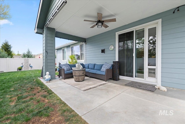 view of patio featuring a ceiling fan, fence, and an outdoor hangout area
