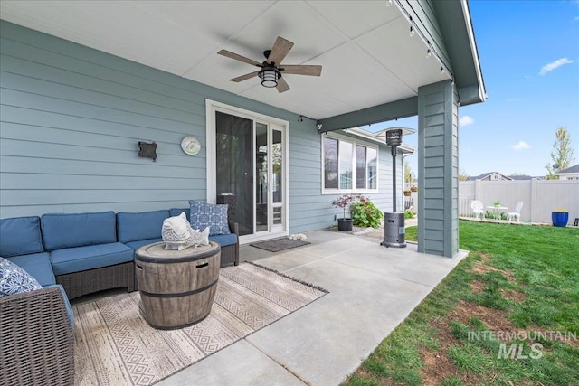 view of patio / terrace featuring ceiling fan, fence, and an outdoor hangout area