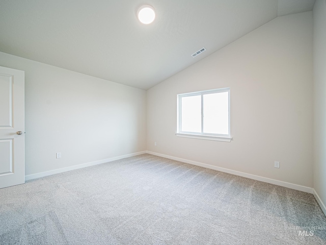 2314 E Cave Falls St, Kuna, ID 83634 - empty room with lofted ceiling, carpet flooring, and baseboards