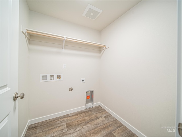 2314 E Cave Falls St, Kuna, ID 83634 - laundry room with hookup for an electric dryer, hookup for a washing machine, wood finished floors, and baseboards