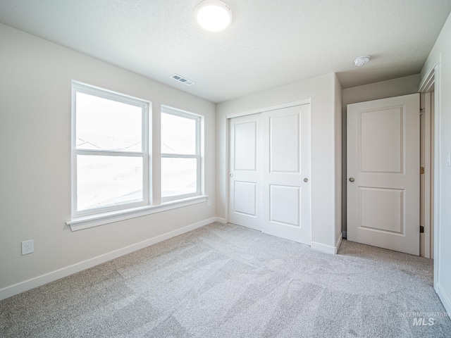 2314 E Cave Falls St, Kuna, ID 83634 - unfurnished bedroom featuring carpet floors, baseboards, and a closet