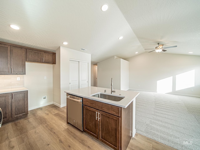2314 E Cave Falls St, Kuna, ID 83634 - kitchen featuring a sink, dishwasher, an island with sink, baseboards, and a ceiling fan