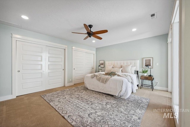 1803 E Danmor Dr, Boise, ID 83712 - carpeted bedroom featuring multiple closets, recessed lighting, baseboards, and a ceiling fan