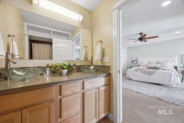 1803 E Danmor Dr, Boise, ID 83712 - ensuite bathroom featuring double vanity, ceiling fan, and recessed lighting