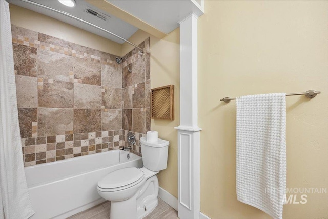 1803 E Danmor Dr, Boise, ID 83712 - bathroom with shower / bath combo with shower curtain, toilet, and baseboards