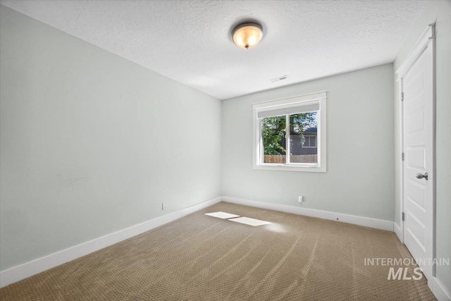 1803 E Danmor Dr, Boise, ID 83712 - unfurnished bedroom featuring carpet floors, baseboards, and a textured ceiling