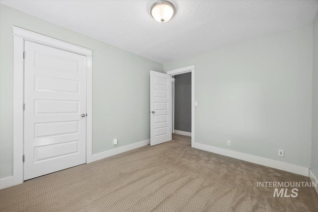 1803 E Danmor Dr, Boise, ID 83712 - unfurnished bedroom with carpet floors and baseboards