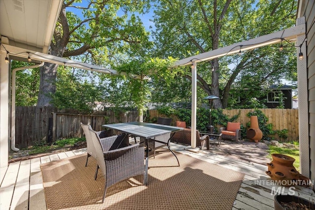 1803 E Danmor Dr, Boise, ID 83712 - fenced backyard featuring outdoor dining area