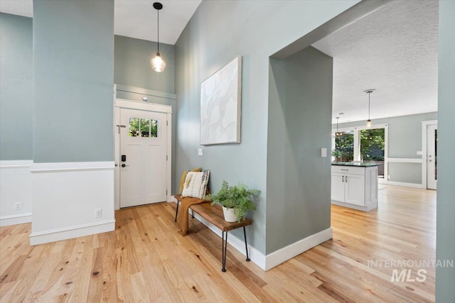 1803 E Danmor Dr, Boise, ID 83712 - foyer with light wood finished floors and baseboards