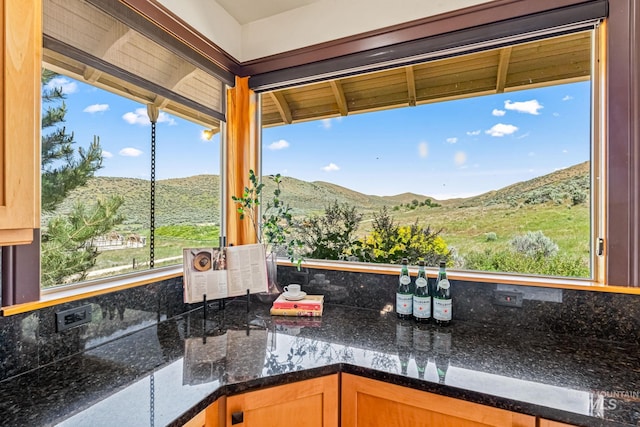4997 N Brookside Ln, Boise, ID 83714 - kitchen featuring tasteful backsplash, a mountain view, and healthy amount of natural light