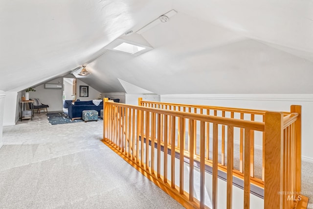 4997 N Brookside Ln, Boise, ID 83714 - hallway featuring carpet, lofted ceiling, a wall mounted air conditioner, a skylight, and an upstairs landing