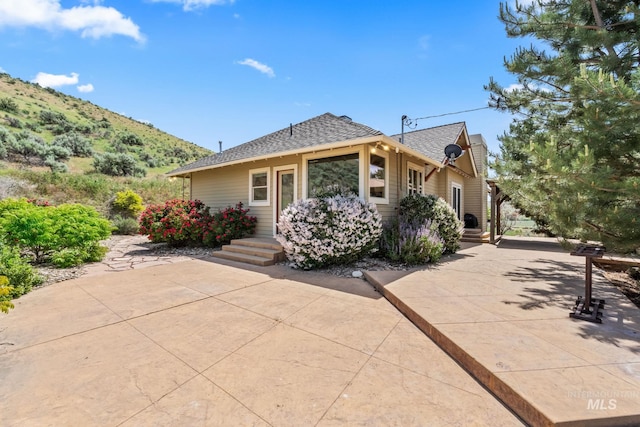 4997 N Brookside Ln, Boise, ID 83714 - view of front of home featuring a shingled roof and a mountain view