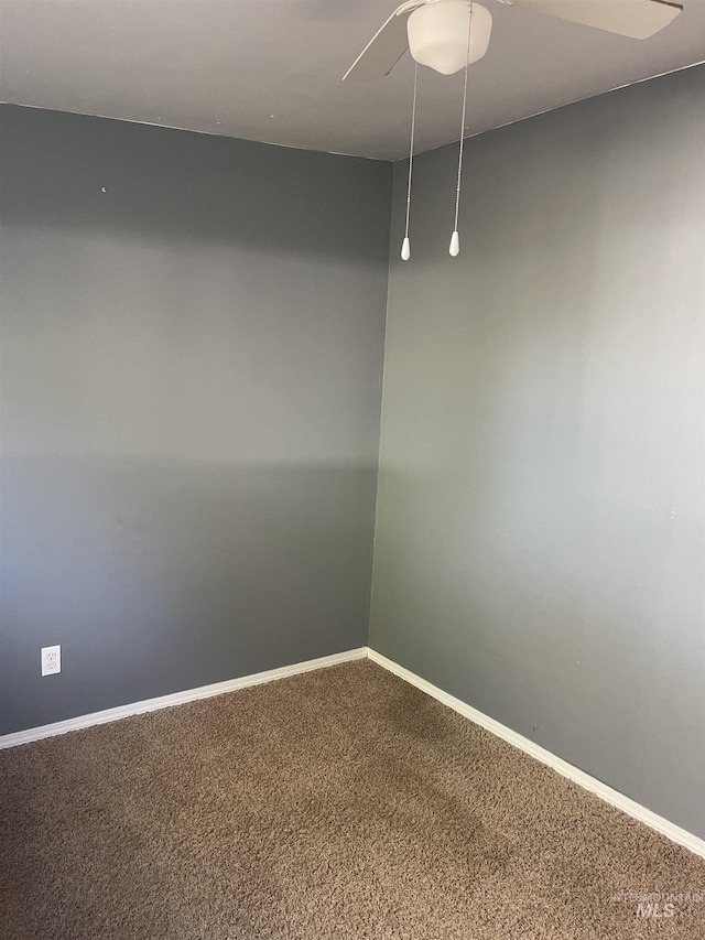 825 S 12th E, Mountain Home, ID 83647 - spare room with carpet floors, ceiling fan, and baseboards