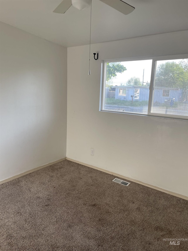 825 S 12th E, Mountain Home, ID 83647 - carpeted empty room with ceiling fan and baseboards