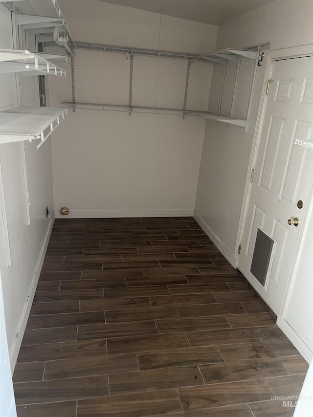 825 S 12th E, Mountain Home, ID 83647 - walk in closet featuring dark wood-type flooring