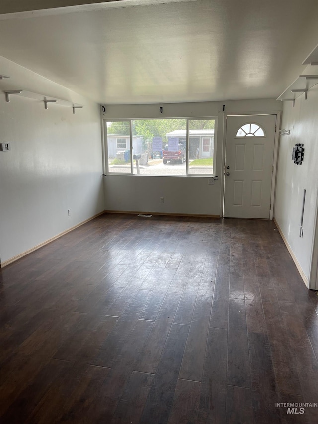 825 S 12th E, Mountain Home, ID 83647 - foyer entrance with dark wood-style floors and baseboards