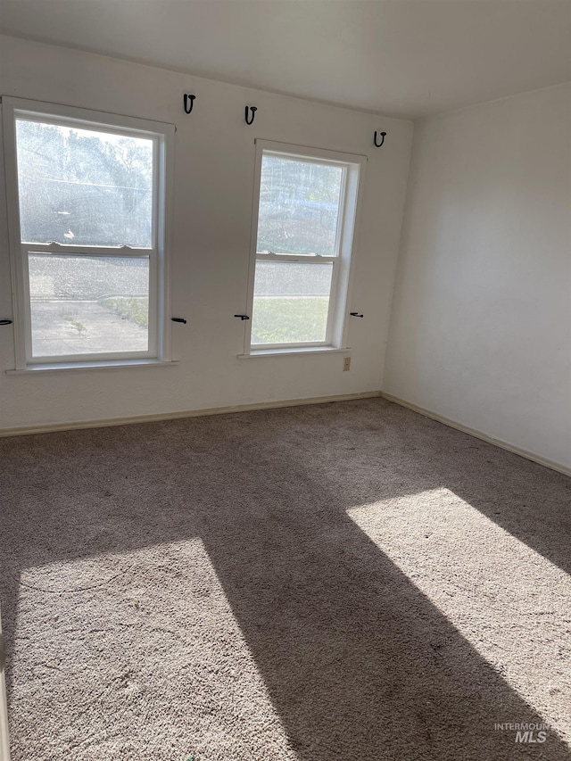 825 S 12th E, Mountain Home, ID 83647 - carpeted empty room featuring baseboards